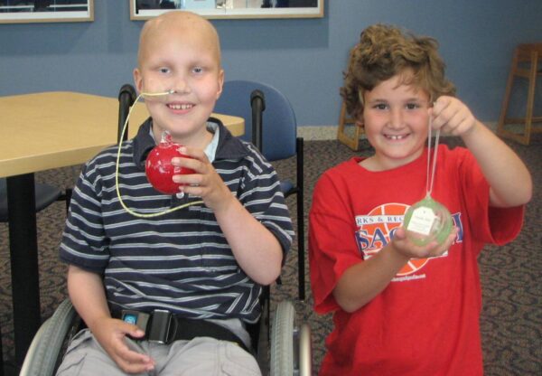 Skyler and Natalie showing their ornaments