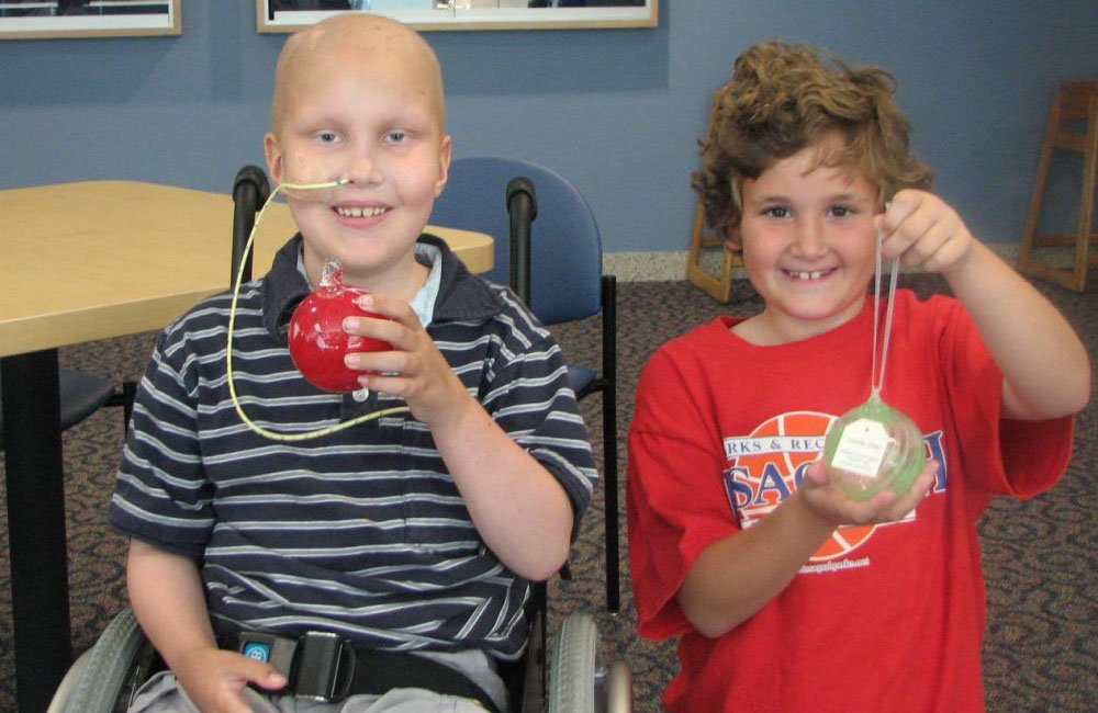 Skyler and Natalie showing their ornaments